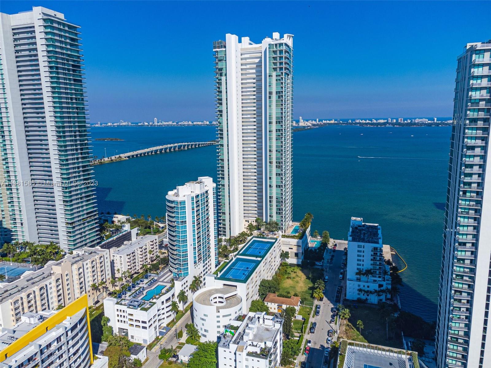 Edgewater Miami, FL 33137 - Photo 38 of 42 a view of balcony with two chairs and a table