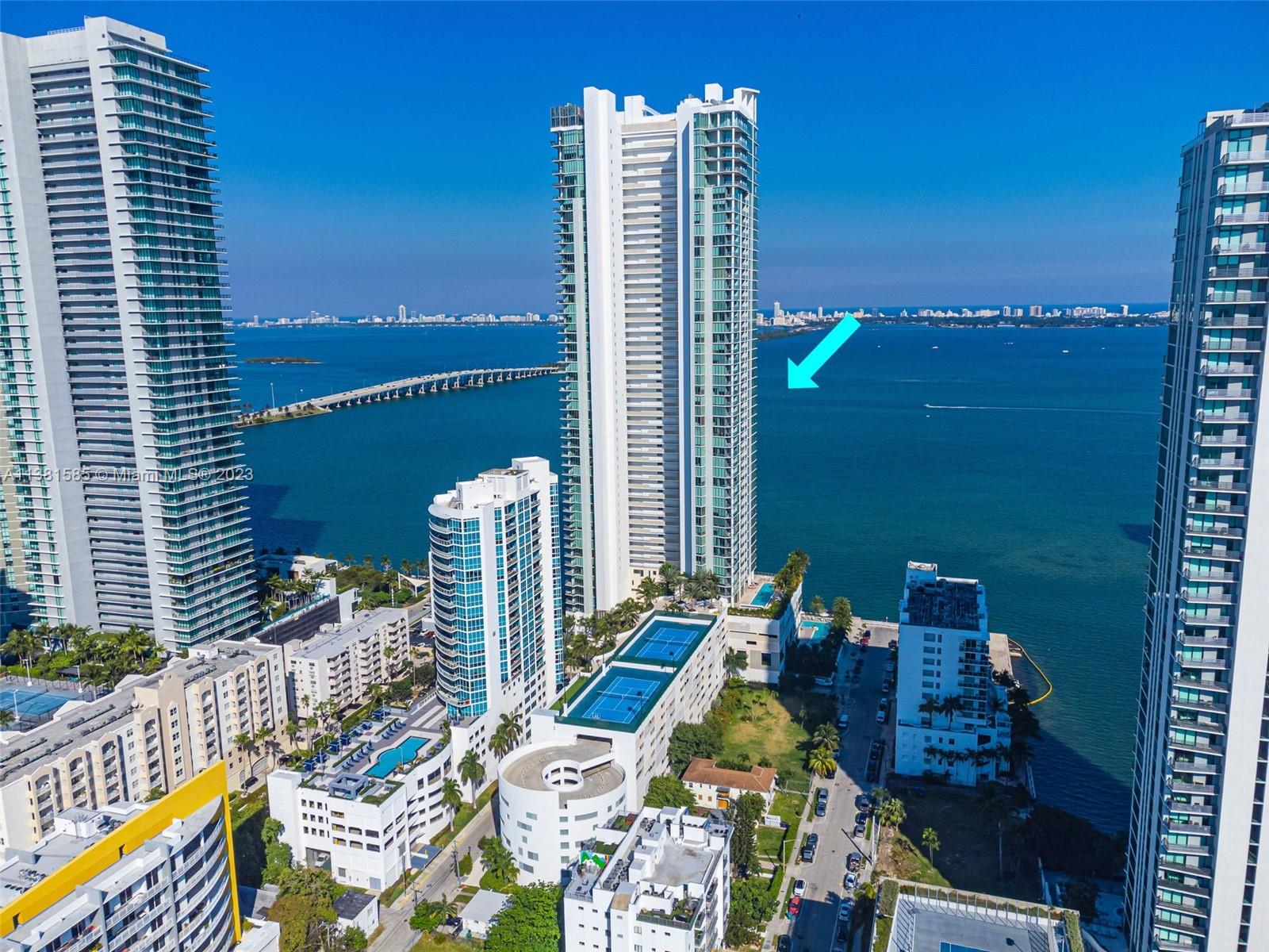 Edgewater Miami, FL 33137 - Photo 40 of 42 a view of balcony with two chairs and a potted plant