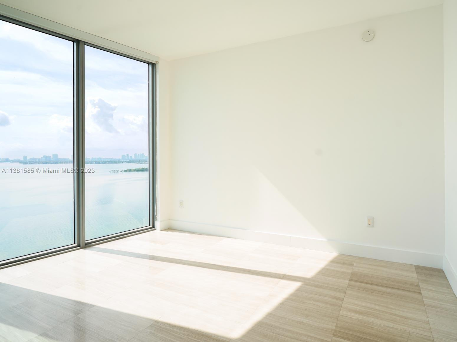 Edgewater Miami, FL 33137 - Photo 6 of 42 a view of a big room with wooden floor