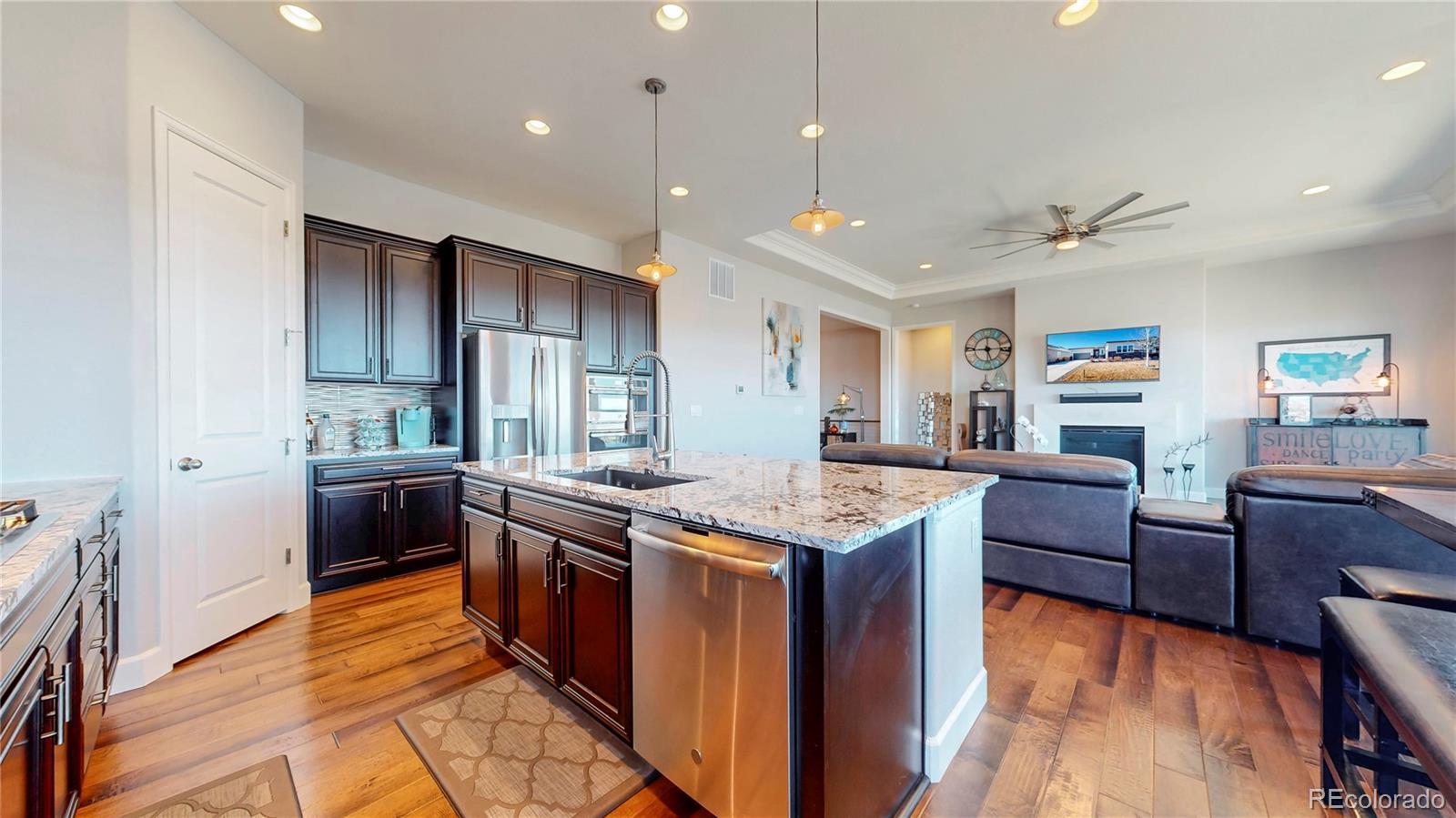 20249 Terrace View Drive Parker, CO 80134 - Photo 11 of 38 a kitchen with stainless steel appliances granite countertop a stove and a refrigerator