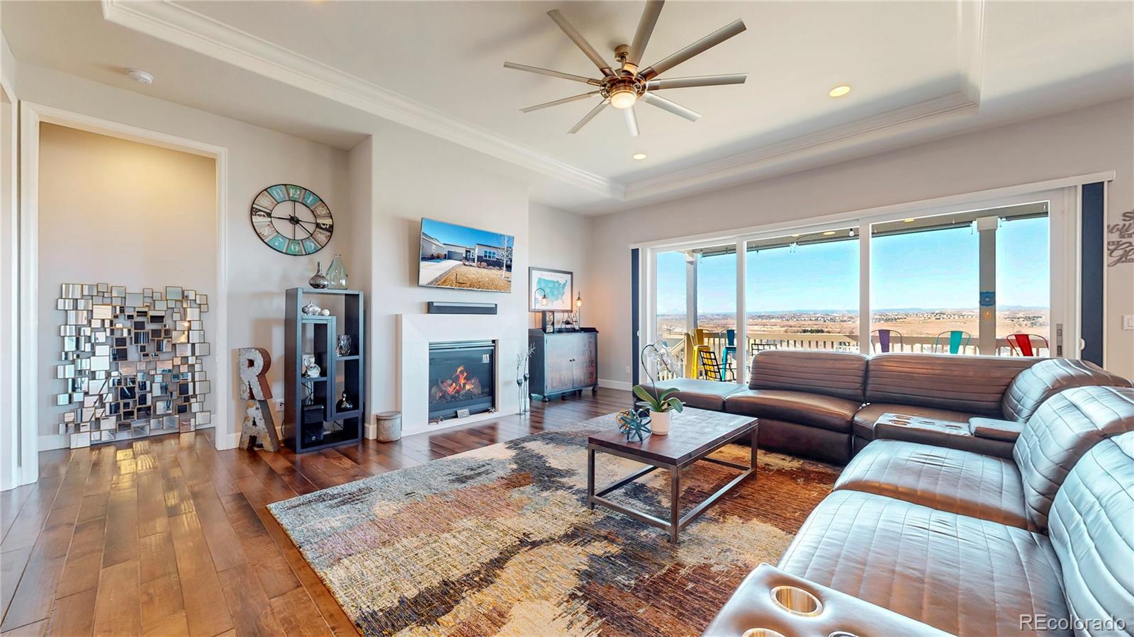 20249 Terrace View Drive Parker, CO 80134 - Photo 6 of 38 a living room with furniture a rug and a flat screen tv
