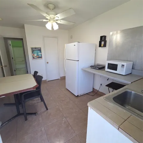 a view of kitchen and sink