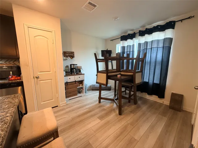 a view of a livingroom with furniture and wooden floor