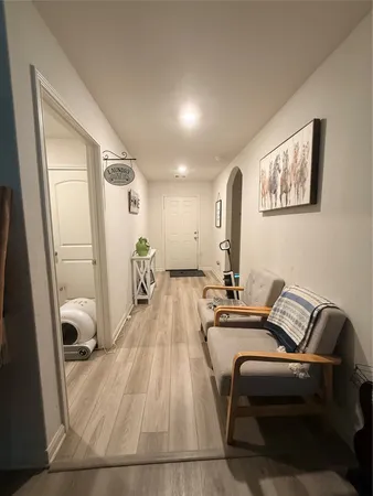 a room with furniture and a wooden floor