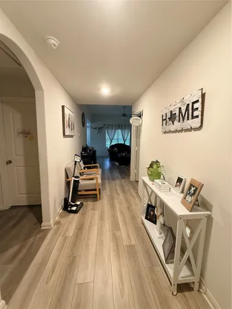 a room with furniture and a wooden floor