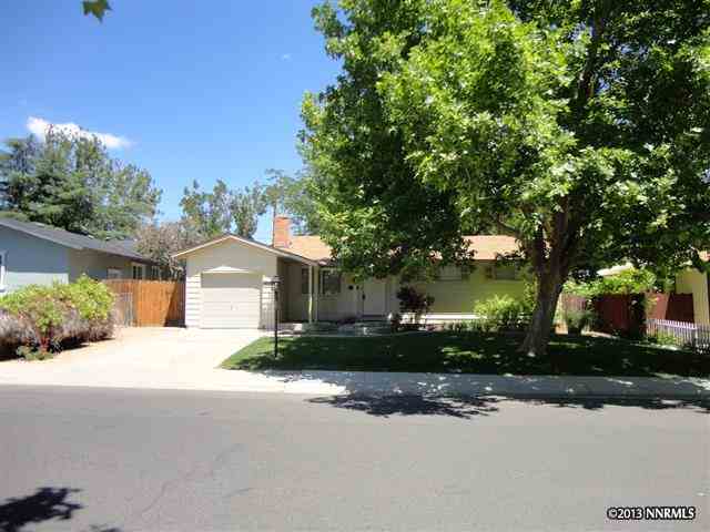 1120 Beldon Way Reno, NV 89503 - Photo 1 of 1 a front view of a house with a yard and a garage