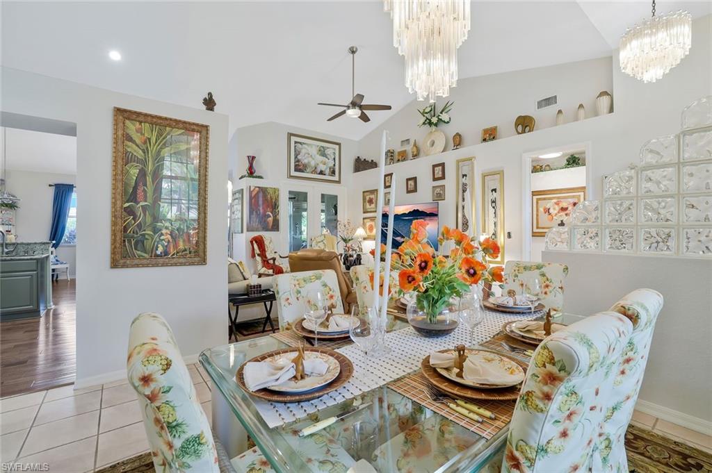 186 Muirfield Circle Naples, FL 34113 - Photo 13 of 32 a very nice looking dining room with furniture a rug and wooden floor
