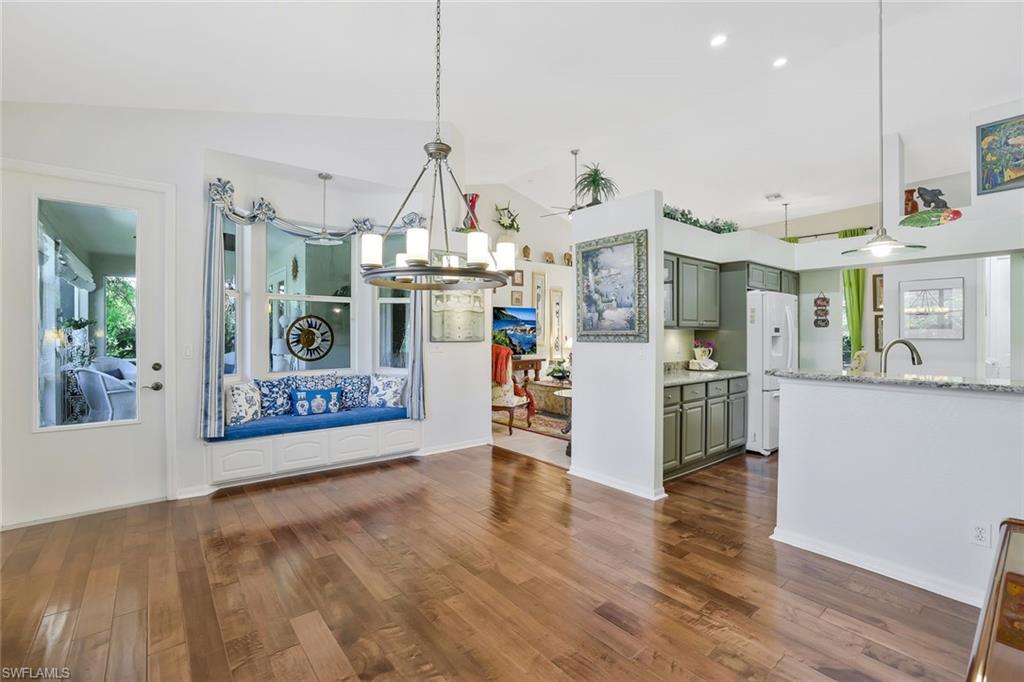 186 Muirfield Circle Naples, FL 34113 - Photo 15 of 32 a view of a living room kitchen and a window