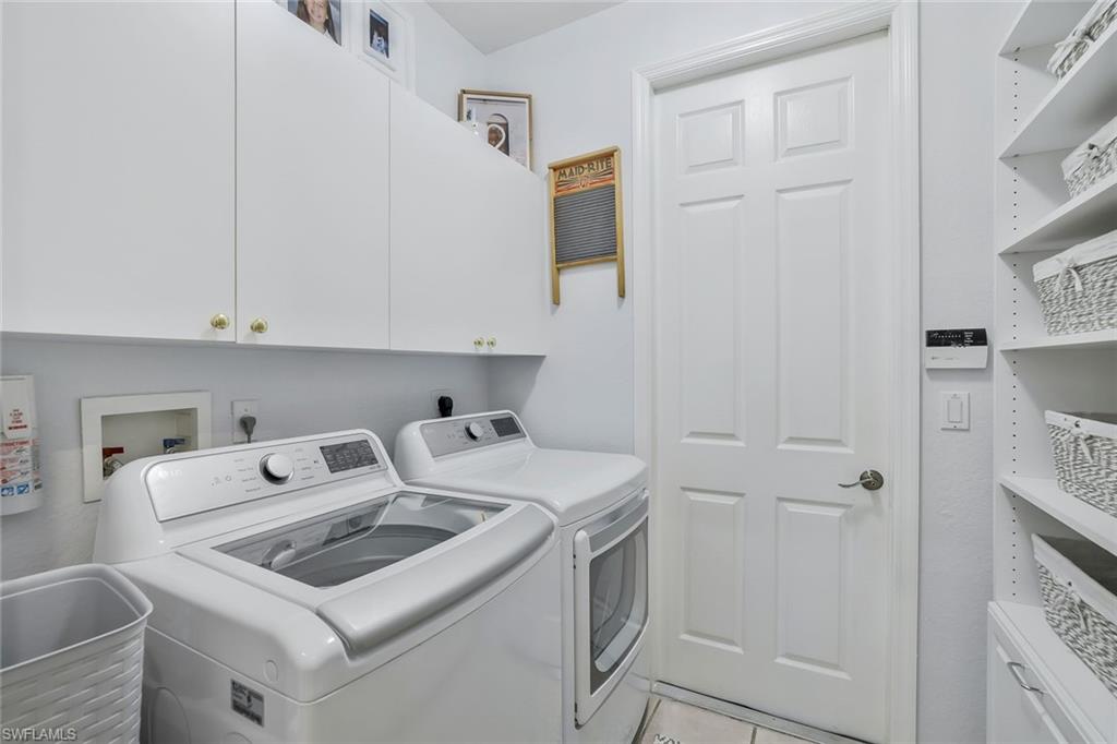 186 Muirfield Circle Naples, FL 34113 - Photo 25 of 32 a utility room with dryer and washer