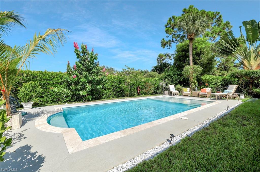 186 Muirfield Circle Naples, FL 34113 - Photo 29 of 32 a view of outdoor space yard and swimming pool