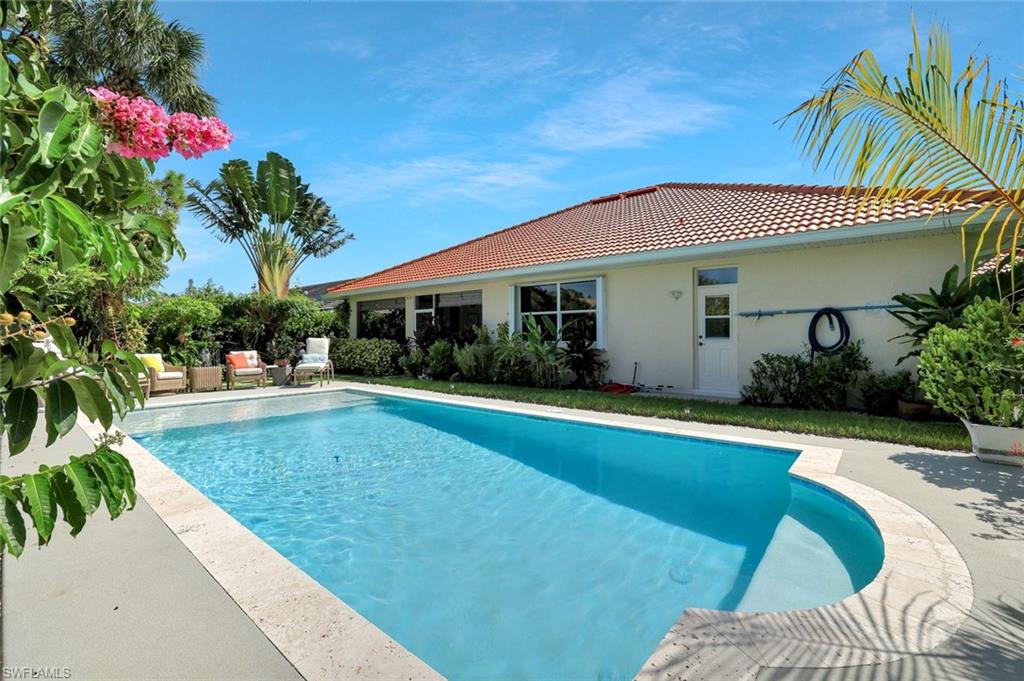 186 Muirfield Circle Naples, FL 34113 - Photo 31 of 32 a view of a house with swimming pool