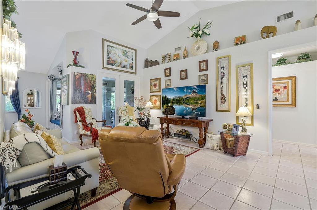 186 Muirfield Circle Naples, FL 34113 - Photo 7 of 32 a living room with furniture