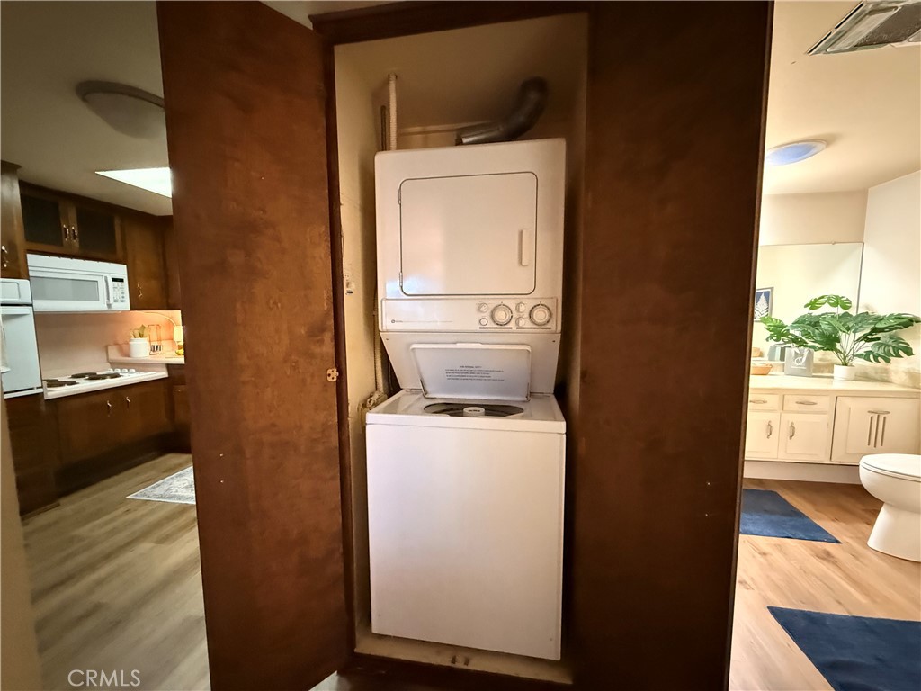 13560 Medinac Lane, Unit 102B Seal Beach, CA 90740 - Photo 11 of 24 a utility room with dryer and washer
