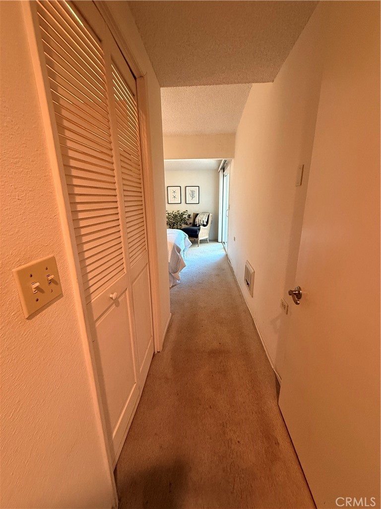 13560 Medinac Lane, Unit 102B Seal Beach, CA 90740 - Photo 12 of 24 a view of a hallway with furniture