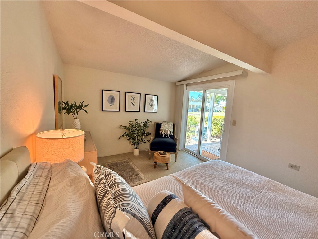 13560 Medinac Lane, Unit 102B Seal Beach, CA 90740 - Photo 15 of 24 a bedroom with bed and window