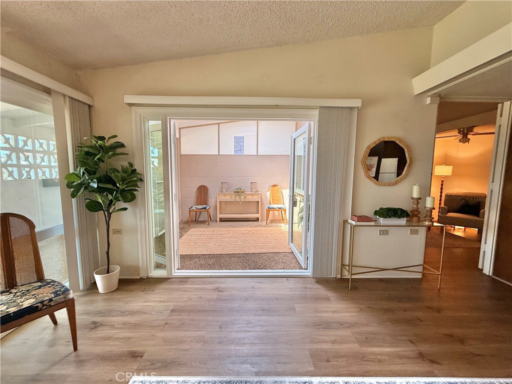 13560 Medinac Lane, Unit 102B Seal Beach, CA 90740 - Photo 3 of 24 a view of living room and kitchen