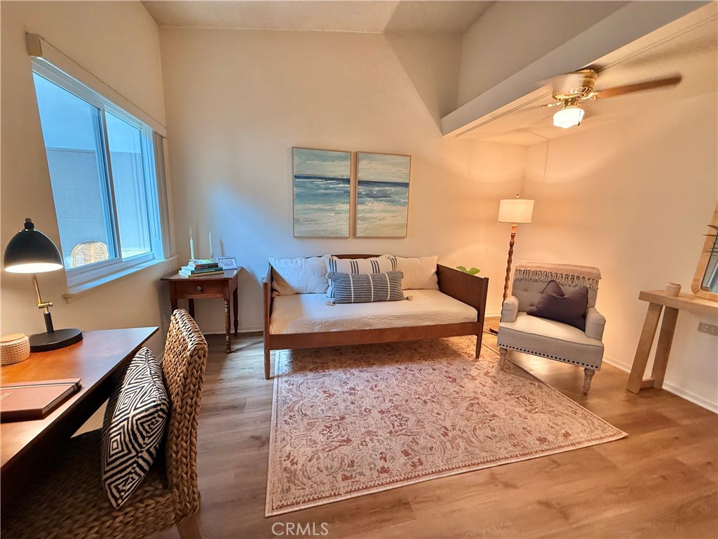13560 Medinac Lane, Unit 102B Seal Beach, CA 90740 - Photo 8 of 24 a living room with furniture and a rug