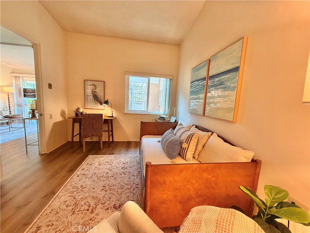 13560 Medinac Lane, Unit 102B Seal Beach, CA 90740 - Photo 9 of 24 a living room with furniture and a couch