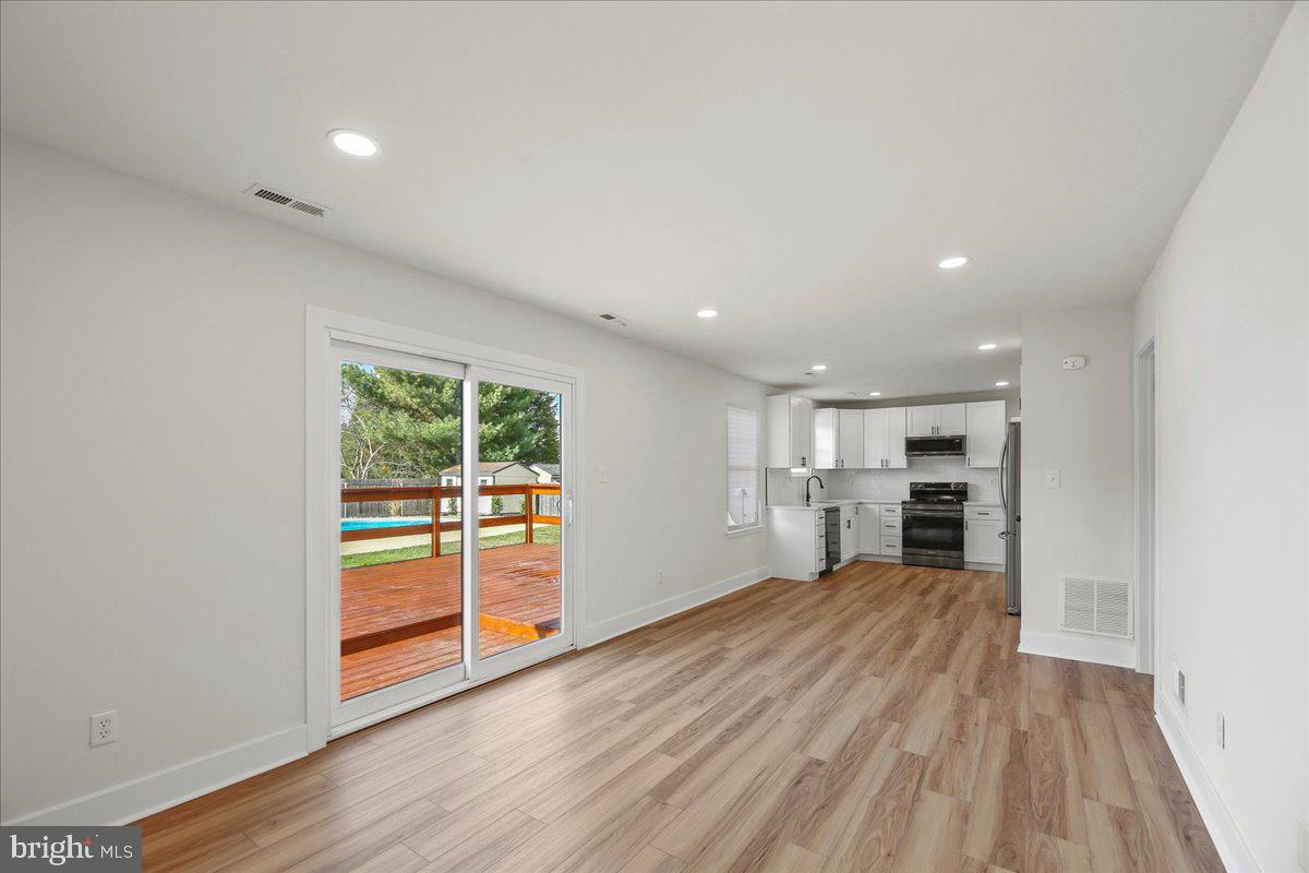 19 Intrepid Drive Sewell, NJ 08080 - Photo 14 of 47 a view of empty room with wooden floor and fireplace