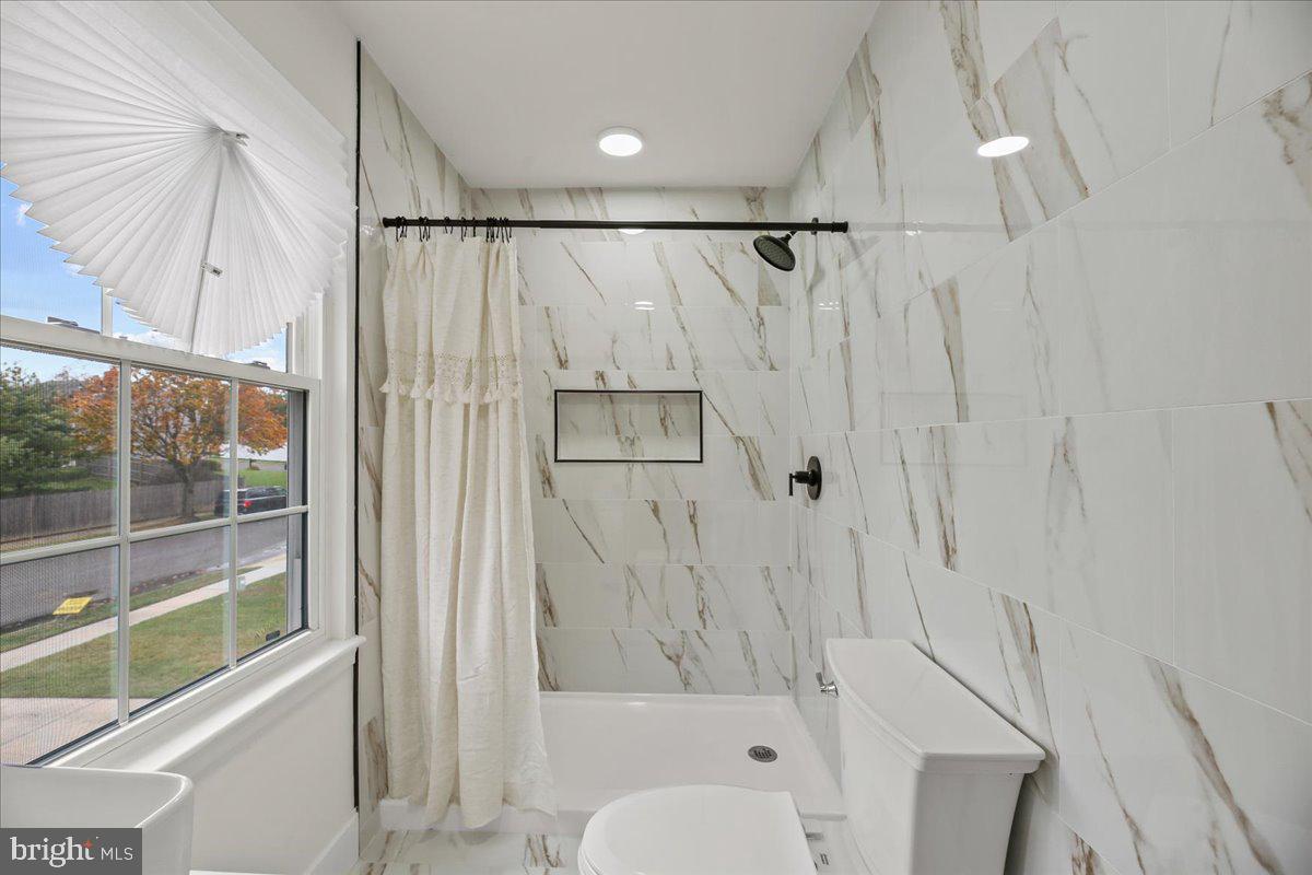 19 Intrepid Drive Sewell, NJ 08080 - Photo 21 of 47 a bathroom with a shower a toilet and a shower