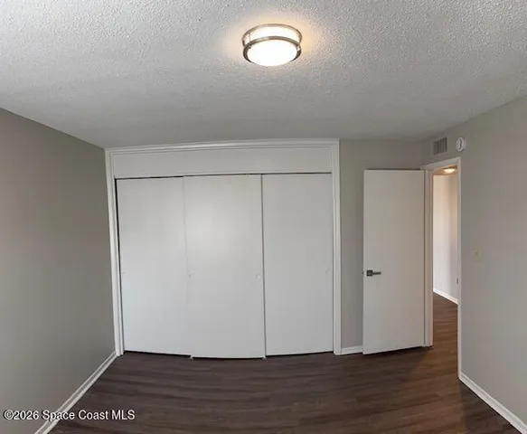 a view of room with hardwood floor