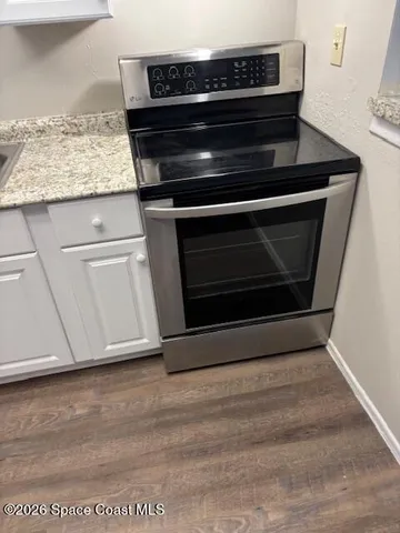 a stove top oven sitting inside of a kitchen