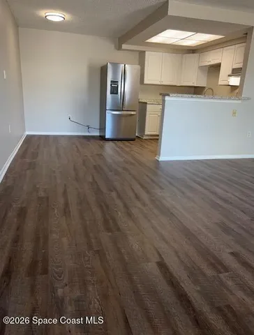 a view of kitchen with wooden floor