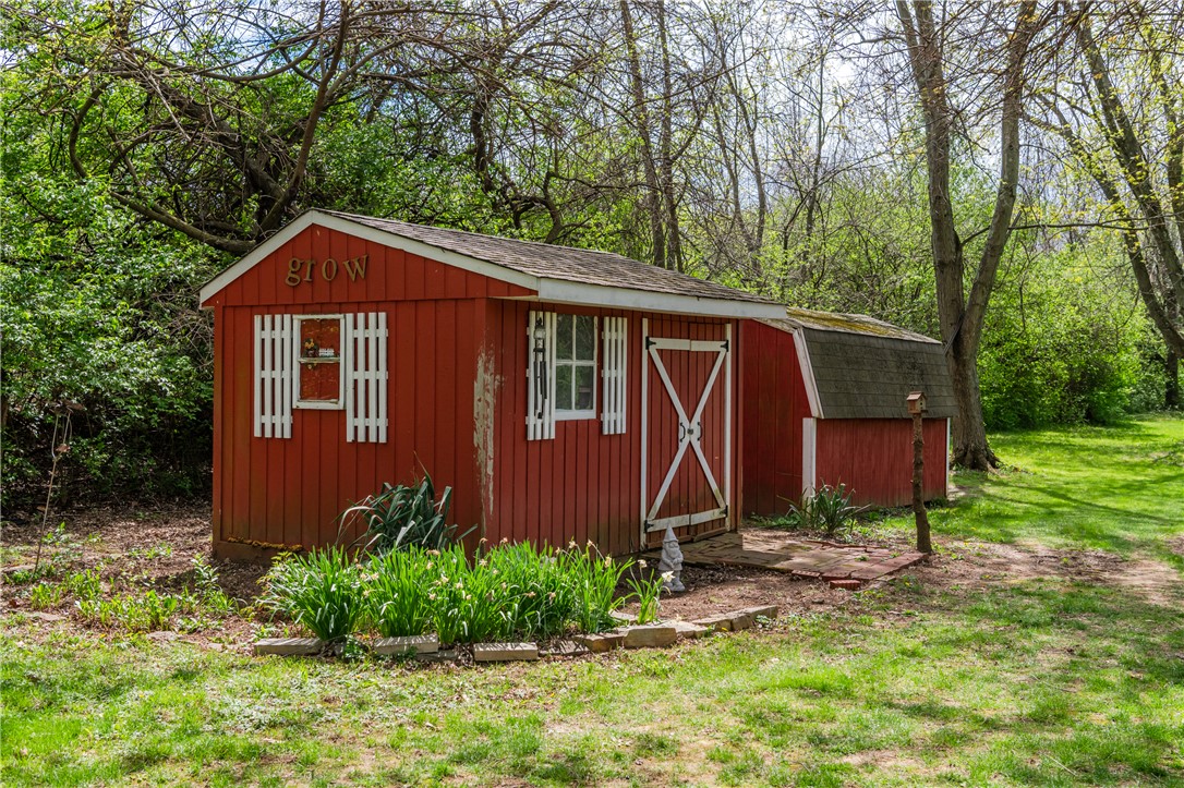 159 East Lytle 5 Points Road Springboro, OH 45066 - Photo 31 of 45 This charming red shed offers functional outdoor storage amidst lush natural surroundings.