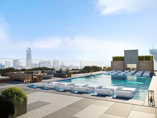 a terrace with outdoor seating city view and barbeque oven