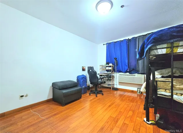 a work room with furniture and wooden floor
