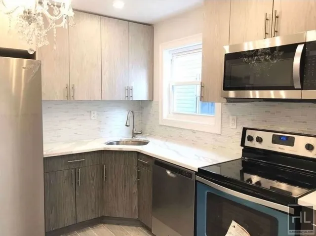 a kitchen with a sink and a microwave