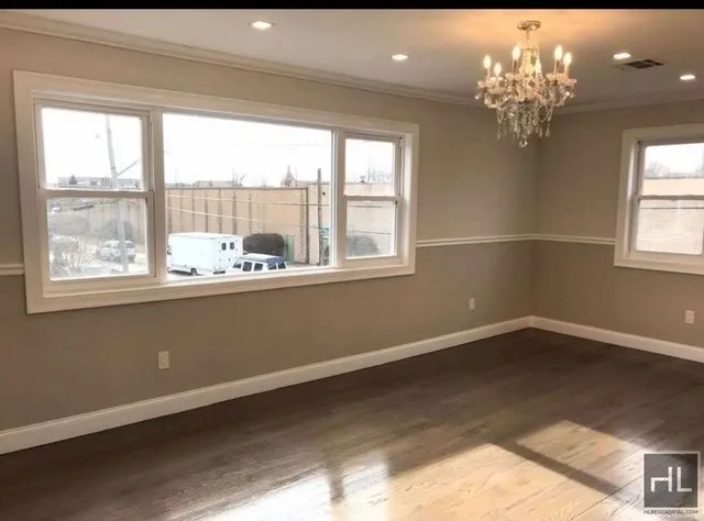 a view of a room with a large window