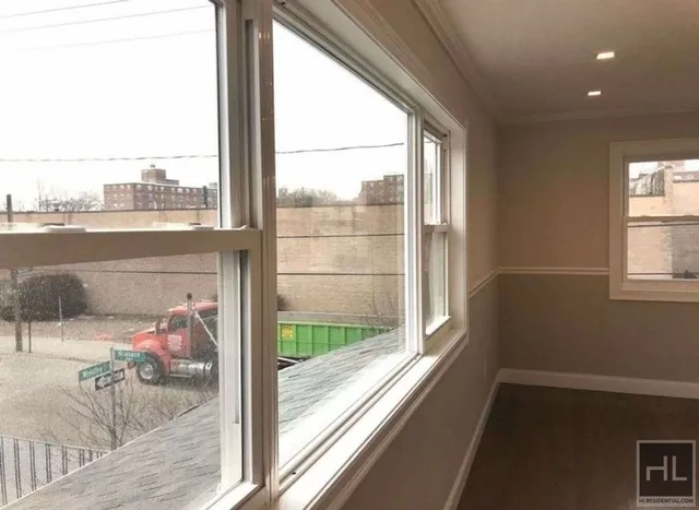 a view of a living room and a floor to ceiling window