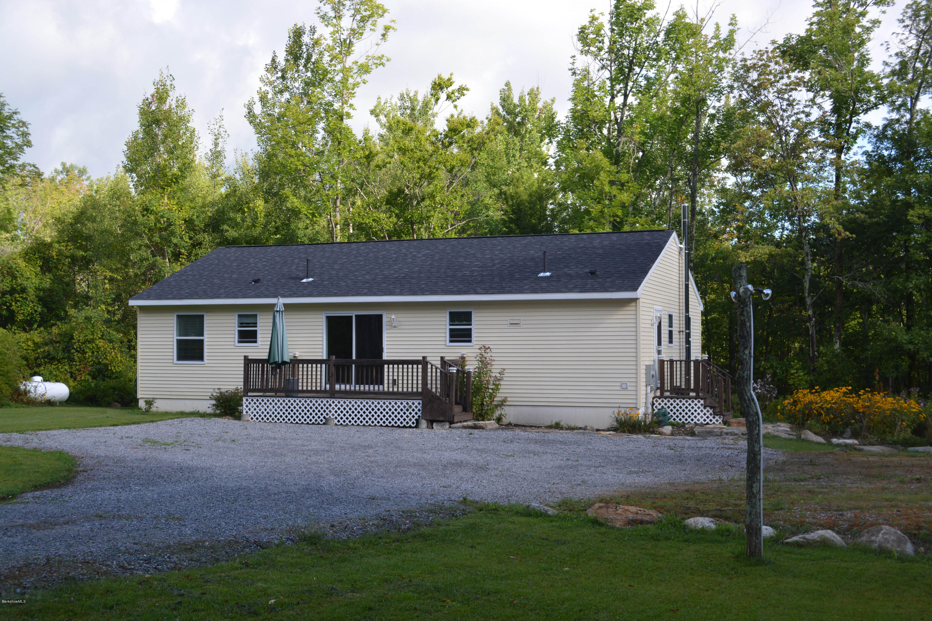 220 Sandisfield Road Sandisfield, MA 01255 - Photo 1 of 30 a view of a house with backyard and a tree