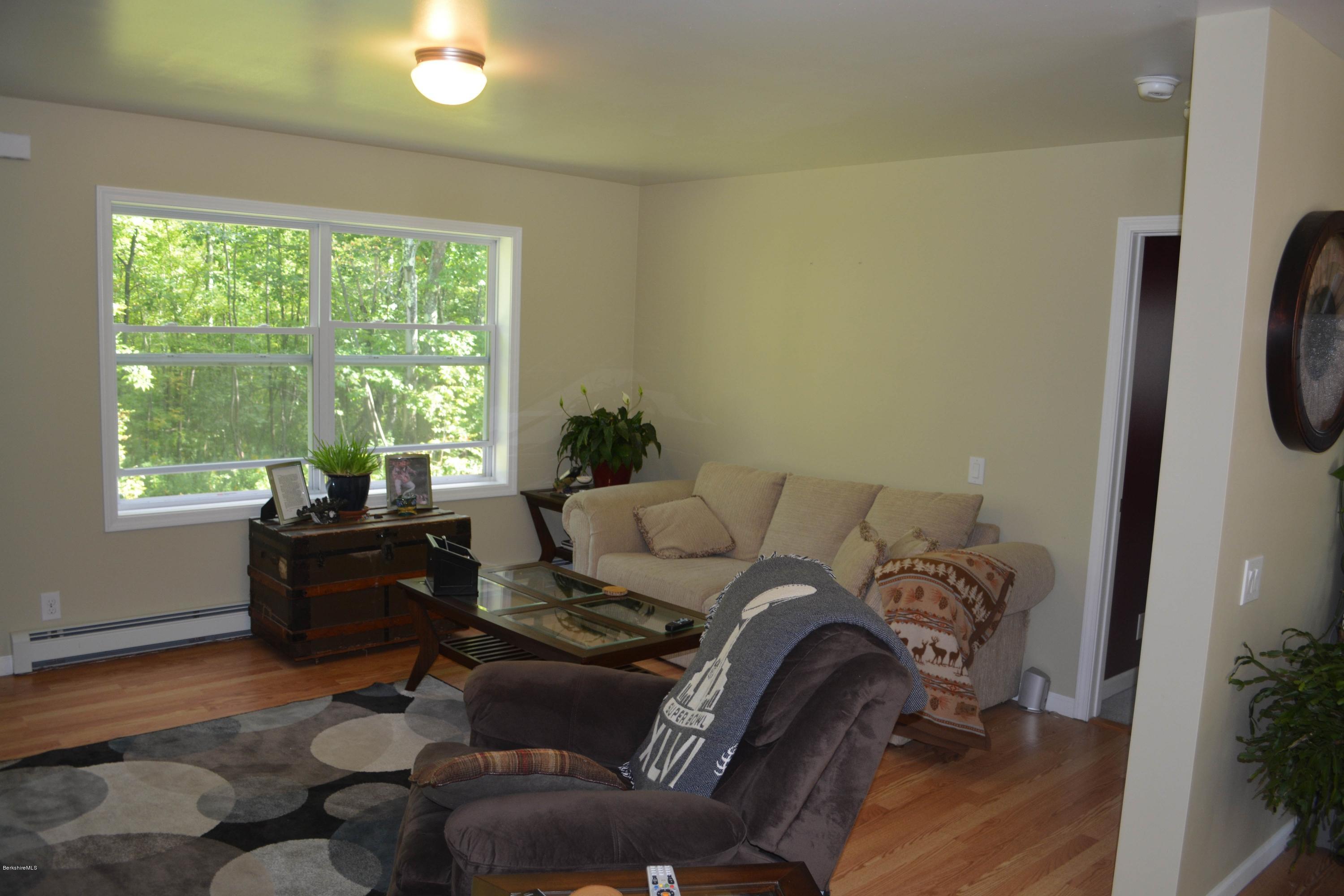 220 Sandisfield Road Sandisfield, MA 01255 - Photo 9 of 30 a living room with furniture and a window