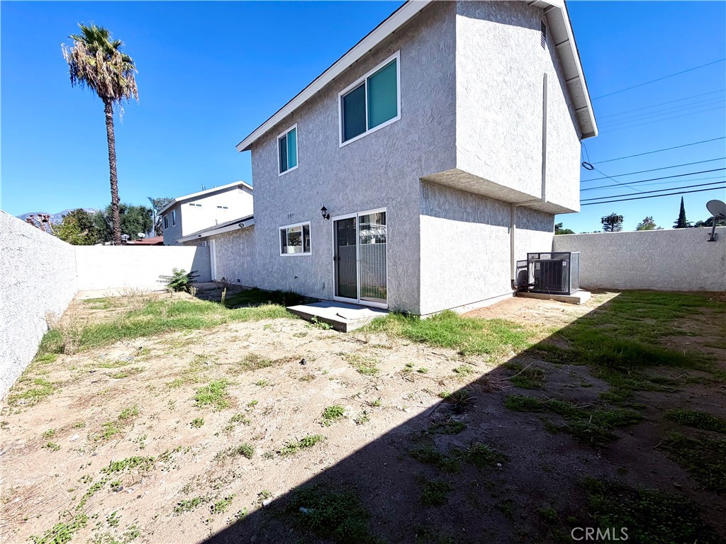 417 North Grove Avenue, Unit A Ontario, CA 91764 - Photo 15 of 17 a front view of a house with a yard