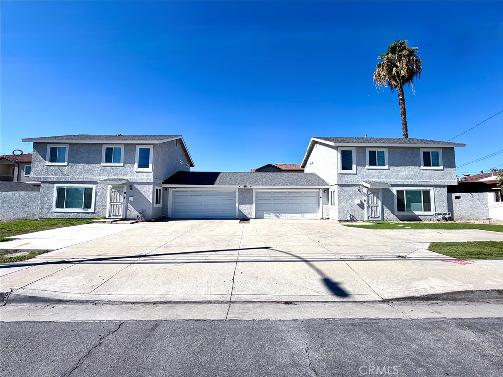 417 North Grove Avenue, Unit A Ontario, CA 91764 - Photo 2 of 17 a front view of a house with a yard