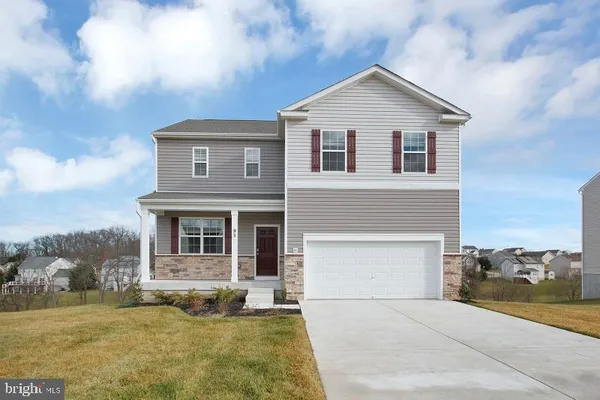 a front view of a house with yard