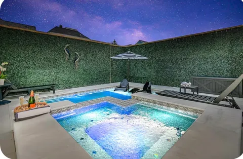 a view of a swimming pool with a patio