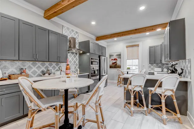 a view of a workspace with furniture and wooden floor