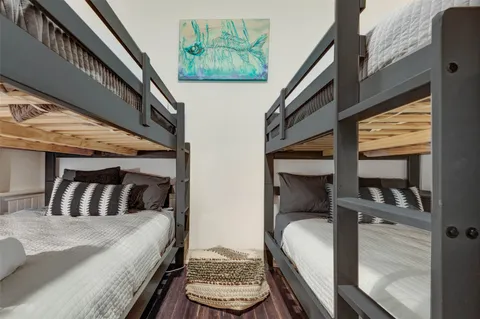 a bedroom with bed and a window