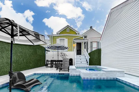 a view of a chairs and table in the balcony