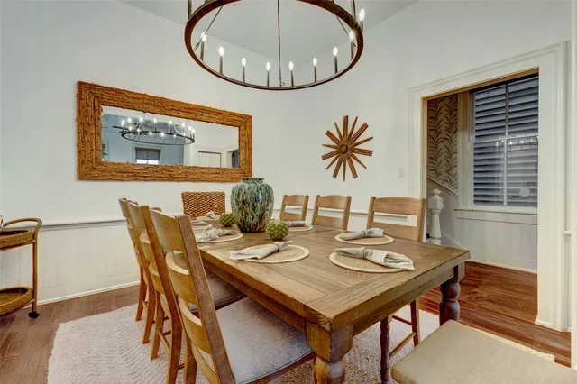 a bedroom with a bed and painting on the wall