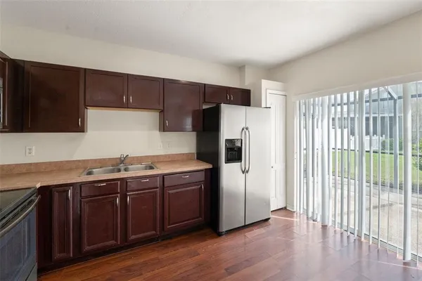 a kitchen with stainless steel appliances a refrigerator and a sink