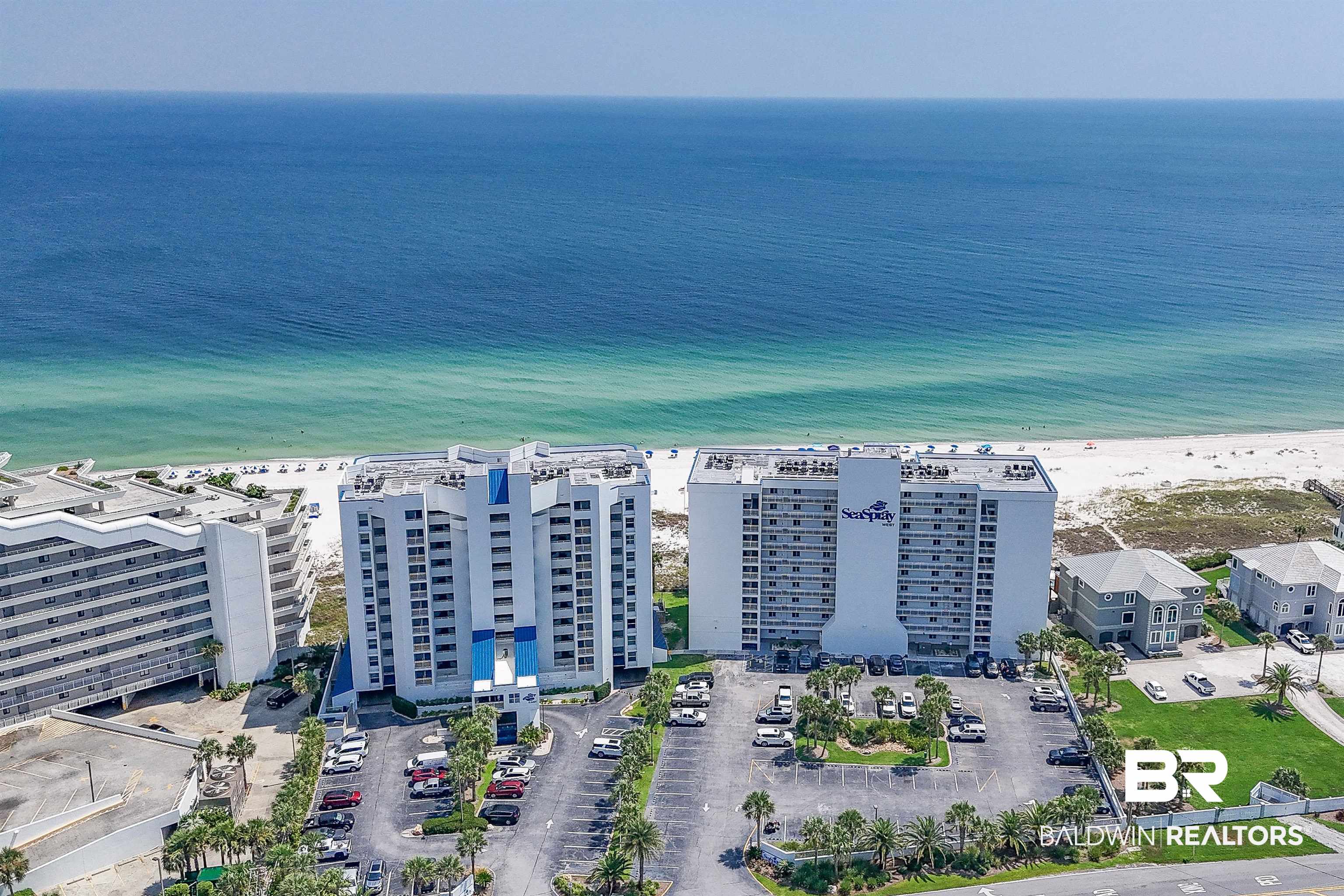 16287 Perdido Key Drive, Unit 105 Pensacola, FL 32507 - Photo 4 of 66 Beachfront high-rise building featuring multiple levels of private balconies, direct access to a white sand beach, and expansive ocean waters