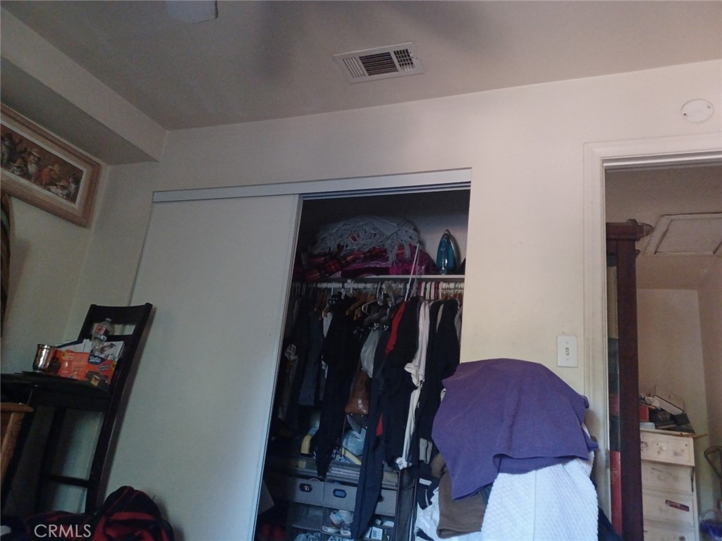 25508 Paloma Road Highland, CA 92410 - Photo 5 of 17 a view of a closet with storage