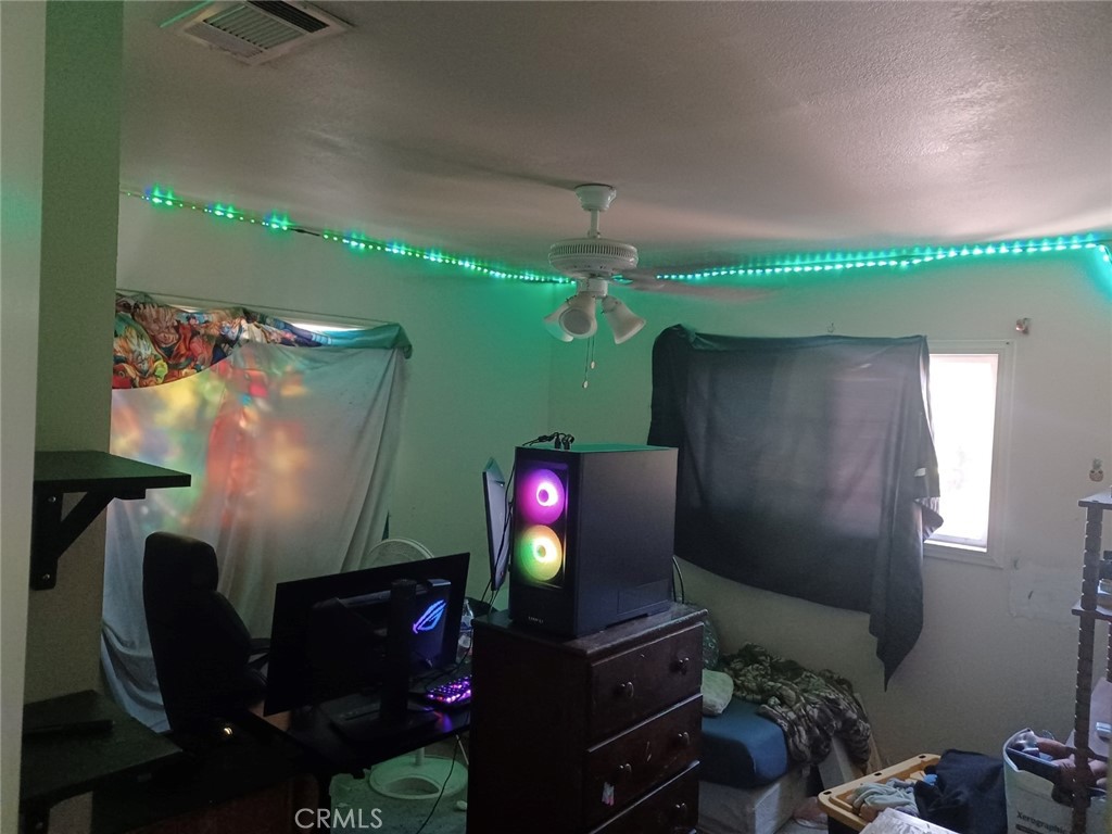 25508 Paloma Road Highland, CA 92410 - Photo 6 of 17 a living room with furniture and a flat screen tv