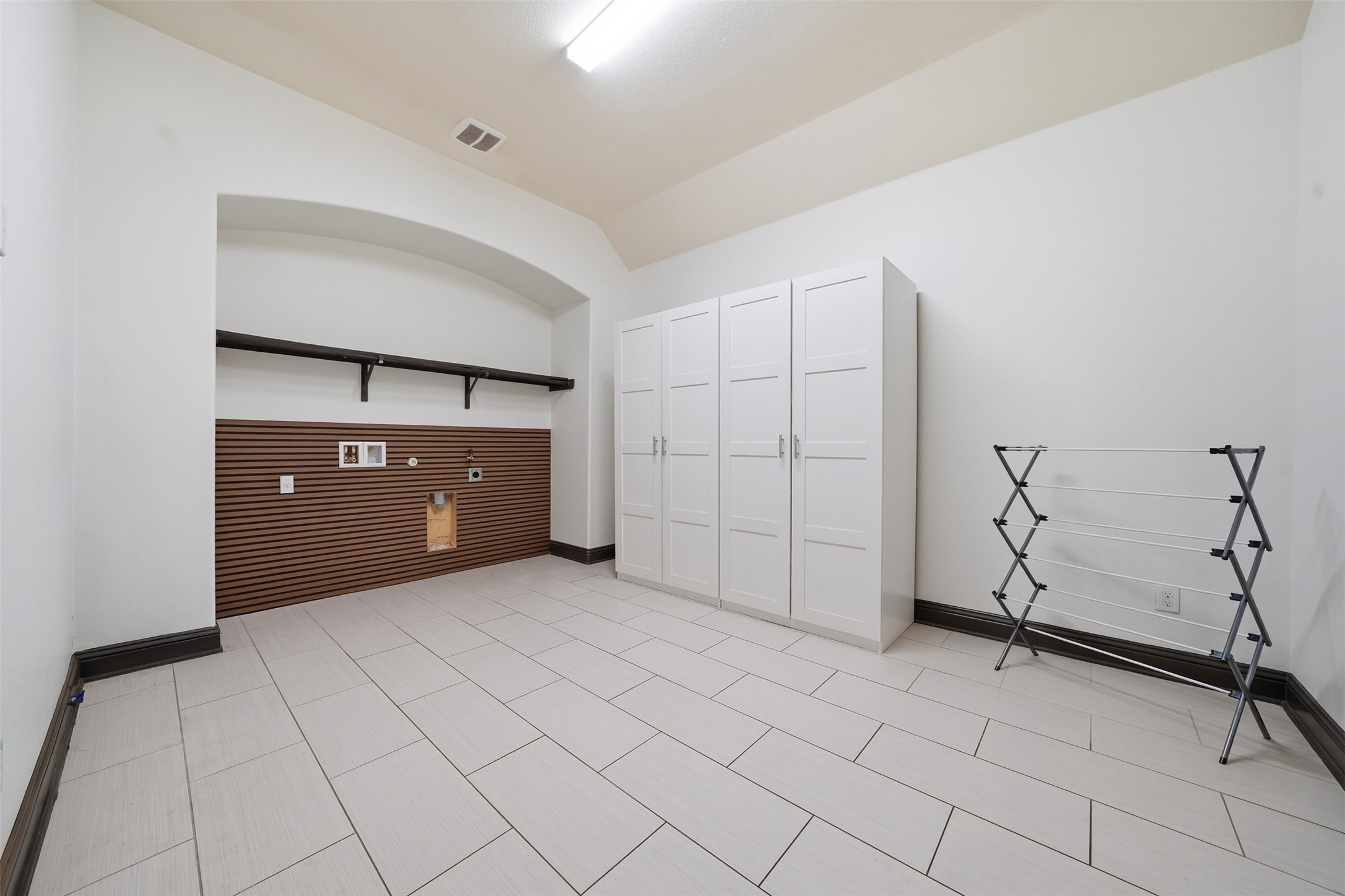 8729 Vantage Point Drive Austin, TX 78737 - Photo 31 of 33 A well-lit utility space provides ample room for laundry and storage solutions.