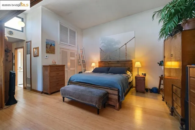 a bedroom with a bed and a couch