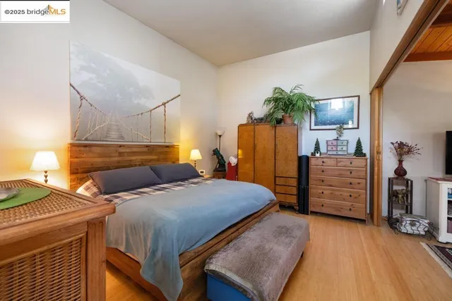 a bedroom with a bed and a walk in closet